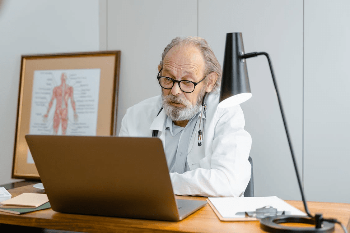 Doctor reviewing prescription refill request online