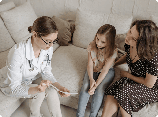 Doctor consulting with mother and child